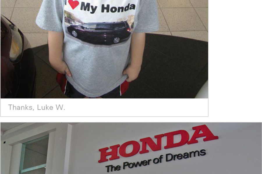 Honda team wearing fan's face on t-shirt